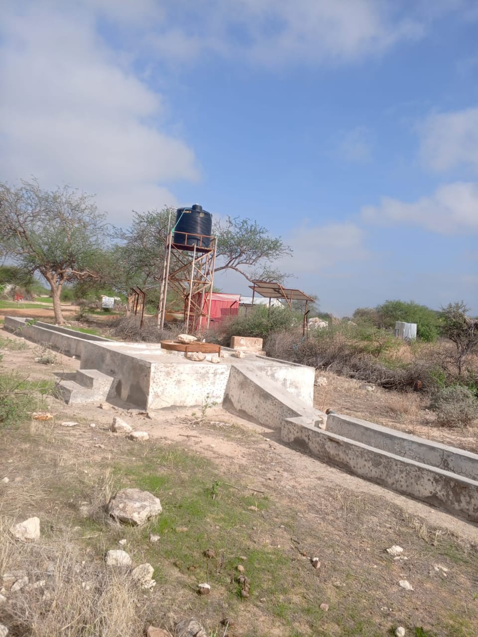 Water tank and concrete trough